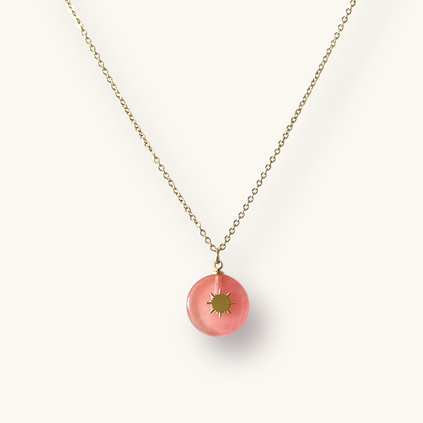 Elegant Gold-Plated Necklace with Pink Sunburst Pendant