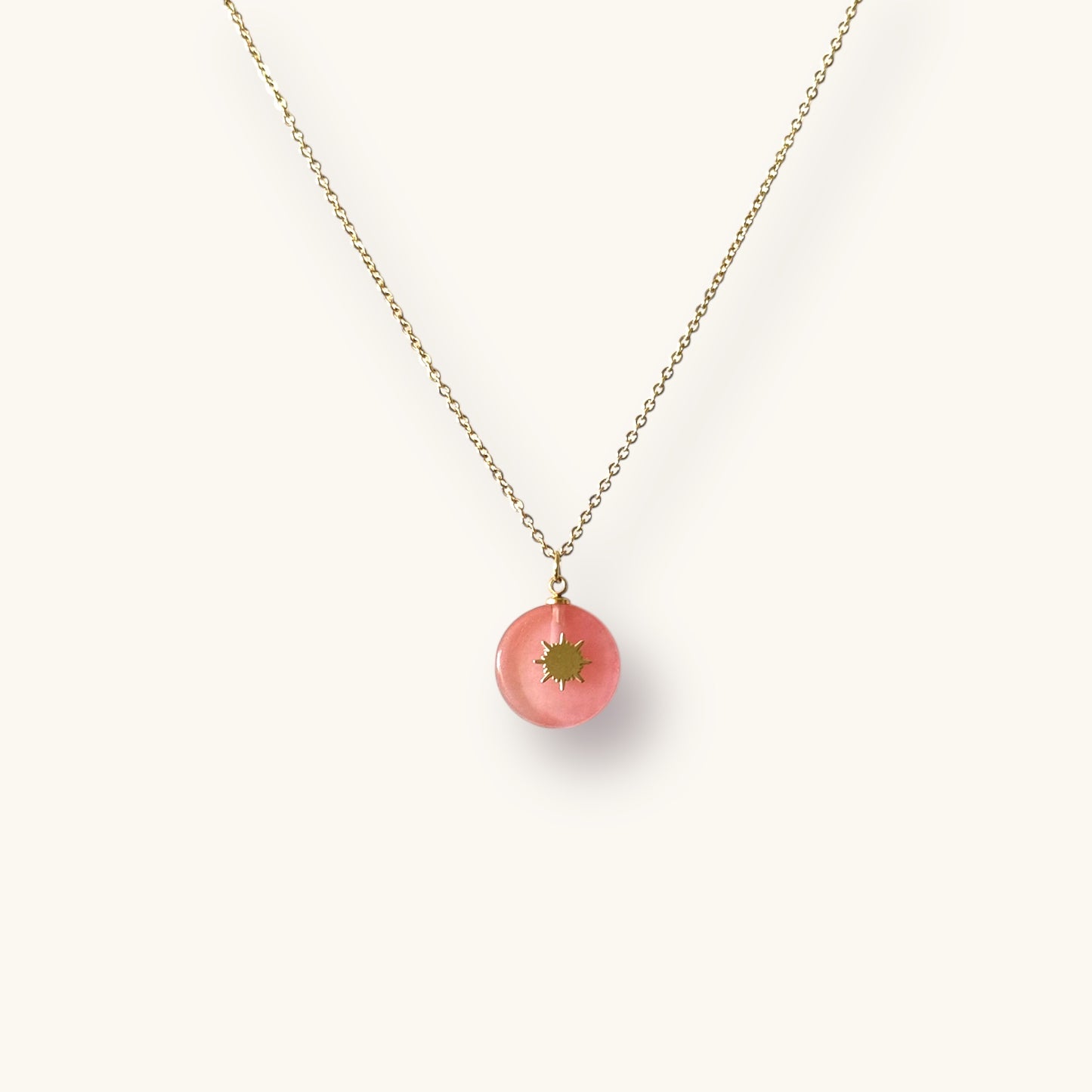 Elegant Gold-Plated Necklace with Pink Sunburst Pendant